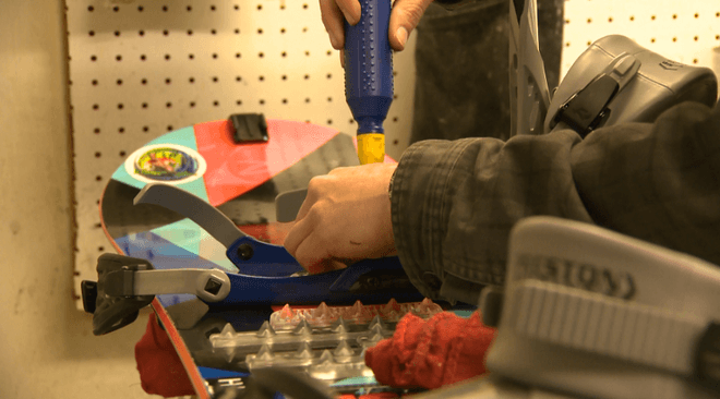 A binding mount in progress at the workbench