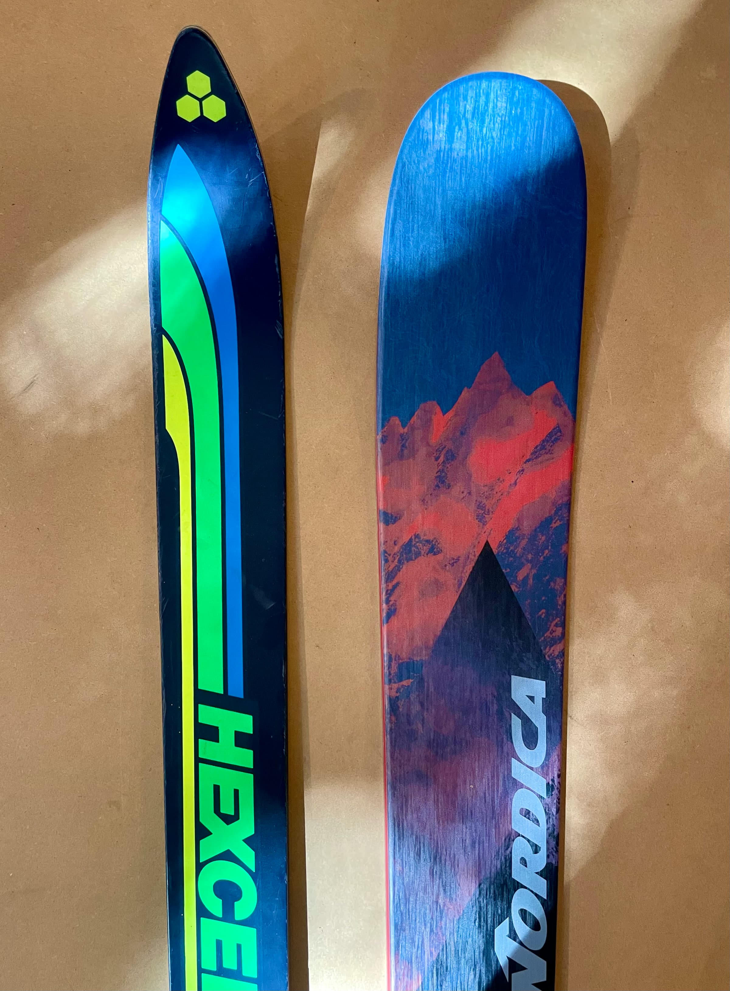 A vintage Hexcel ski beside a current Nordica ski